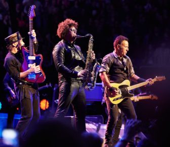 E Street Band members Nils Lofgren and Jake Clemons perform with Bruce Springsteen.