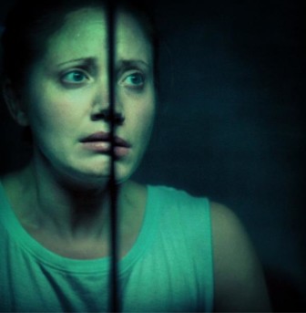 Lynn Justinger stars as a skeptical grad student investigating the paranormal, in "... In the Dark."